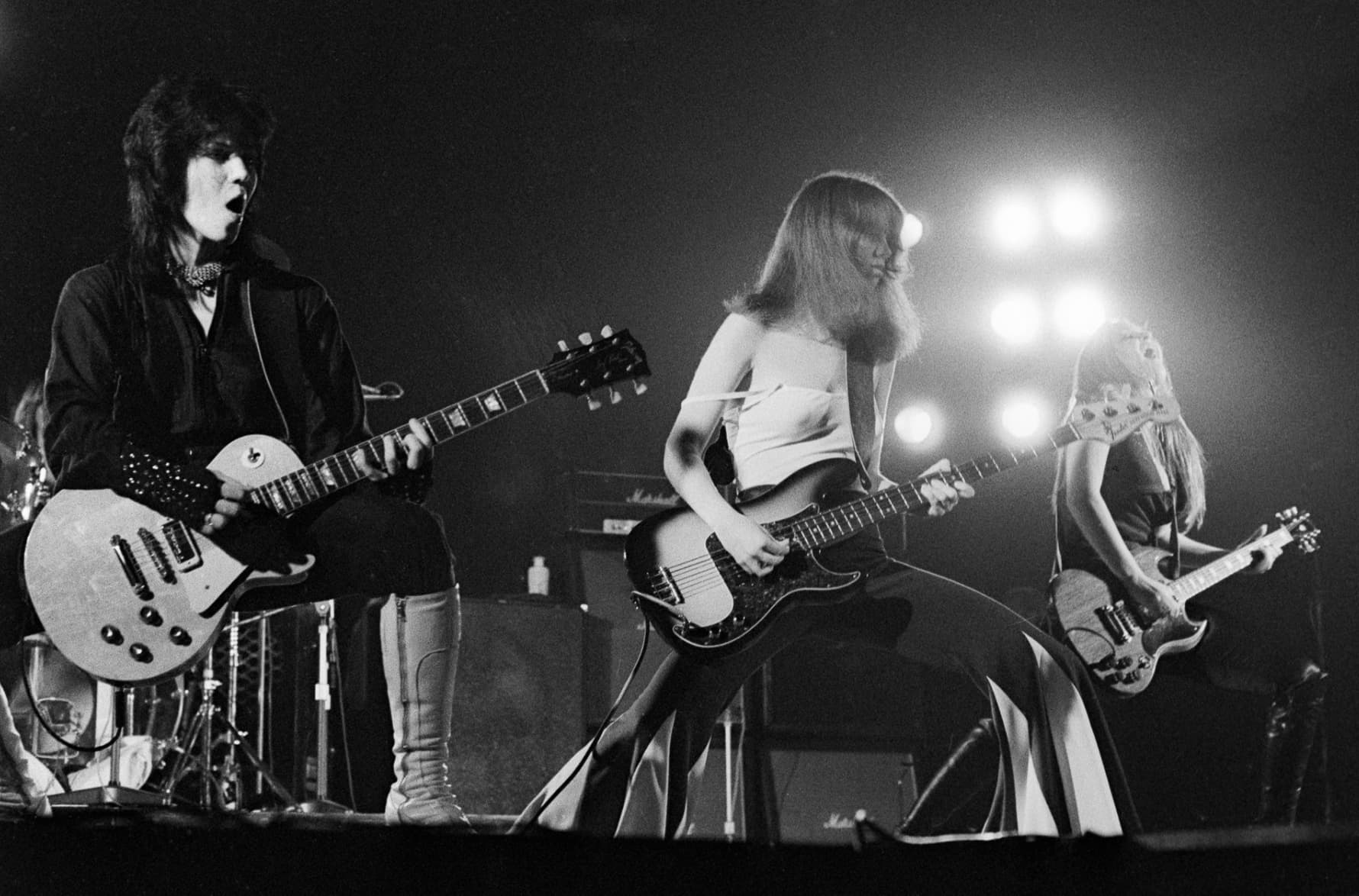 Joan Jett, Jackie Fox, and Lita Ford rock out during a 1976 performance in the United Kingdom. 
